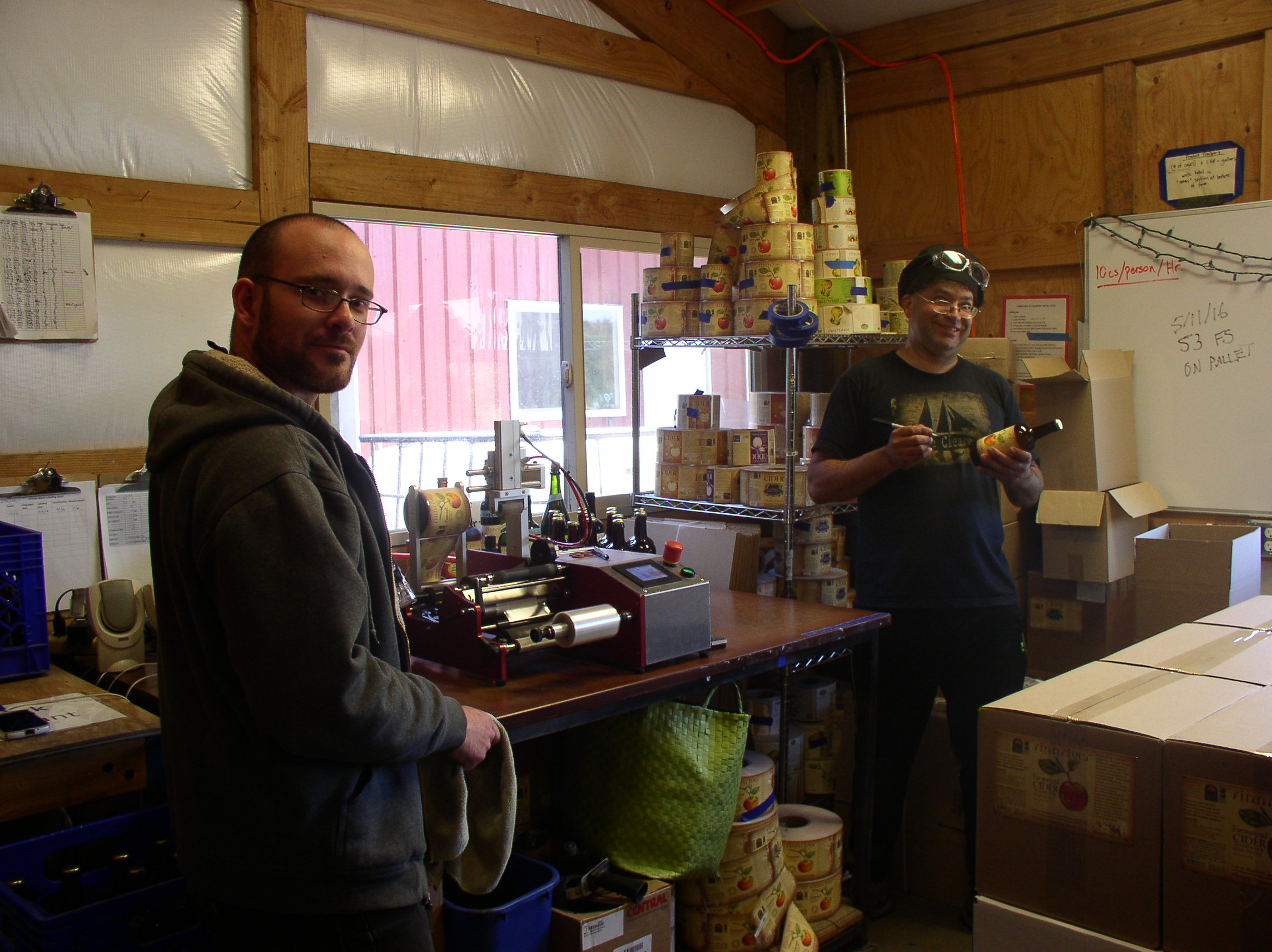 Finishing touches.  Finnriver workers label bottles for transport to market